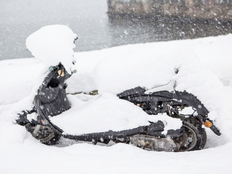 snow covered scooter